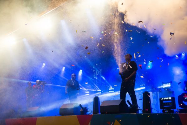 Rick Ross performing on stage at Fables music festival in 2016